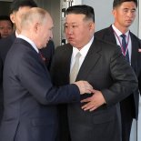 Article thumbnail: It's tempting to revive a long-lost word from the dictionary for the Putin-Kim co-operation: "unasinous", "united in stupidity". (Photo by KCNA VIA KNS / AFP)