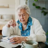 Article thumbnail: Senior woman has financial problems. Counting money, monthly pension, don???t have enough money for paying bills.