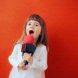 Article thumbnail: Happy cheerful child screaming into the mic