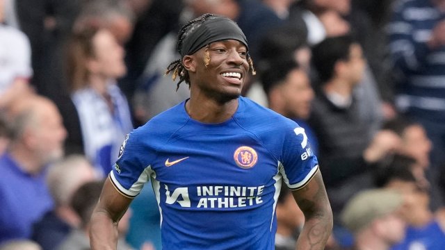 Article thumbnail: Chelsea's Noni Madueke celebrates after scoring his side's third goal during the English Premier League soccer match between Chelsea and West Ham United at Stamford Bridge stadium in London, England, Sunday, May 5, 2024. (AP Photo/Frank Augstein)