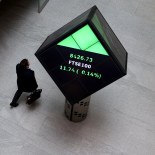 Article thumbnail: A man walks through the lobby of the London Stock Exchange in London, Britain, May 14, 2024. REUTERS/Hannah McKay