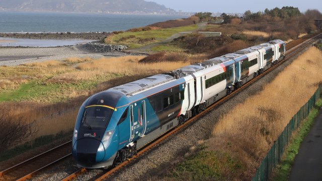 Article thumbnail: Undated handout photo issued by Avanti West Coast of one of its new Hitachi-built Evero trains going through Penmaenmawr, North Wales. The company is launching an initial six of their new trains, which are quieter, have more space for passengers, more reliable wi-fi and reduce carbon emissions, for one of the UK's busiest rail routes, the West Coast Main Line. Issue date: Monday June 3, 2024. PA Photo. The new trains have 16% more seats than the Voyager trains they are replacing, and their introduction has led to additional services between London and Birmingham being added to timetables. See PA story RAIL Avanti. Photo credit should read: Avanti West Coast/PA Wire NOTE TO EDITORS: This handout photo may only be used for editorial reporting purposes for the contemporaneous illustration of events, things or the people in the image or facts mentioned in the caption. Reuse of the picture may require further permission from the copyright holder.