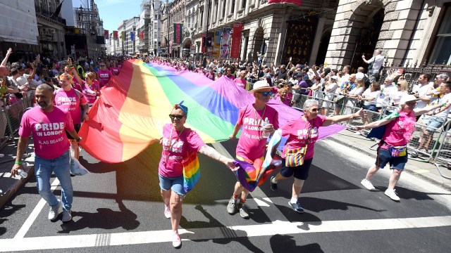 Article thumbnail: LONDON, ENGLAND - JUNE 29: The rainbow flag is carried along Piccadilly by parade-goers during Pride In London 2024 on June 29, 2024 in London, England. (Photo by Eamonn M. McCormack/Getty Images for Pride In London)