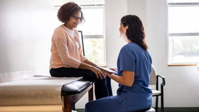 Article thumbnail: Doctor and senior woman discussing treatment in doctors office