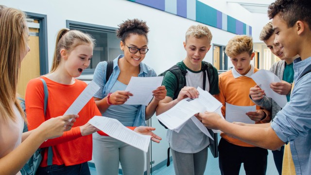 Article thumbnail: Happy students have received their exam results in high school. They are cheering and celebrating.