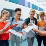 Article thumbnail: Happy students have received their exam results in high school. They are cheering and celebrating.