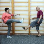 Article thumbnail: A nurse shows to men single-leg squats by wall bars in the gym at the Kyiv Geriatric Care Home, Kyiv, capital of Ukraine, May 29, 2019. Ukrinform.PHOTOGRAPH BY Ukrinform / Future Publishing (Photo credit should read Hennadii Minchenko/Future Publishing via Getty Images)