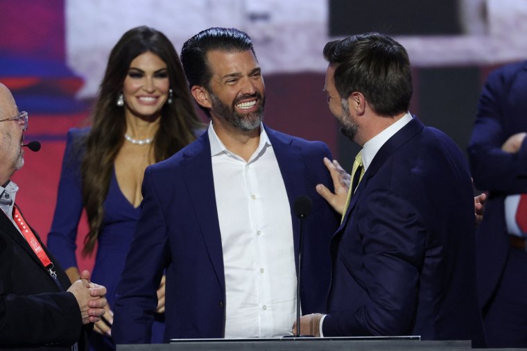 Republican vice presidential nominee J.D. Vance is joined onstage by Donald Trump Jr. and Kimberly Guilfoyle while they do their walk-thru on the stage ahead of Day 2 of the Republican National Convention (RNC), at the Fiserv Forum in Milwaukee, Wisconsin, U.S., July 16, 2024. REUTERS/Mike Segar