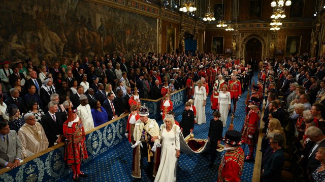 Britain's King Charles and Queen Camilla walk through the Royal Gallery on the day of the State Opening of Parliament at the Palace of Westminster in London, Britain, July 17, 2024. REUTERS/Hannah McKay/Pool