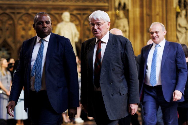 Britain's Foreign Secretary David Lammy (L) and Britain's main opposition Conservative Party Shadow Foreign Secretary Andrew Mitchell process through the Central Lobby during the State Opening of Parliament at the Houses of Parliament, in London, on July 17, 2024. (Photo by Dan Kitwood / POOL / AFP) (Photo by DAN KITWOOD/POOL/AFP via Getty Images)