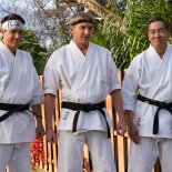 Article thumbnail: Cobra Kai. (L to R) Ralph Macchio as Daniel LaRusso, William Zabka as Johnny Lawrence, Yuji Okumoto as Chozen in Cobra Kai. Cr. Curtis Bonds Baker/Netflix ?? 2024