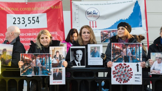 LONDON, UNITED KINGDOM - DECEMBER 11: Bereaved relatives who lost loved-ones during the pandemic demonstrate outside Dorland House as Prime Minister Rishi Sunak gives evidence to the COVID inquiry in London, United Kingdom on December 11, 2023. The inquiry, chaired by Baroness Heather Hallett, has been set up to examine the UK's response to and impact of the Covid-19 pandemic with Module 2 focused on core political and administrative decision-making. (Photo by Wiktor Szymanowicz/Anadolu via Getty Images)