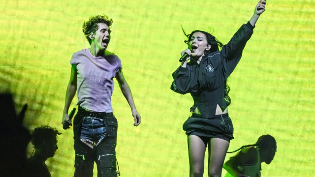 Article thumbnail: LONDON, ENGLAND - JUNE 27: Charli XCX joins Troye Sivan on stage during the Something to Give Each Other Tour at OVO Arena Wembley on June 27, 2024 in London, England. (Photo by Katja Ogrin/Redferns)